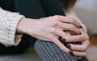 Deciding About Divorce, image of a woman removing her wedding ring