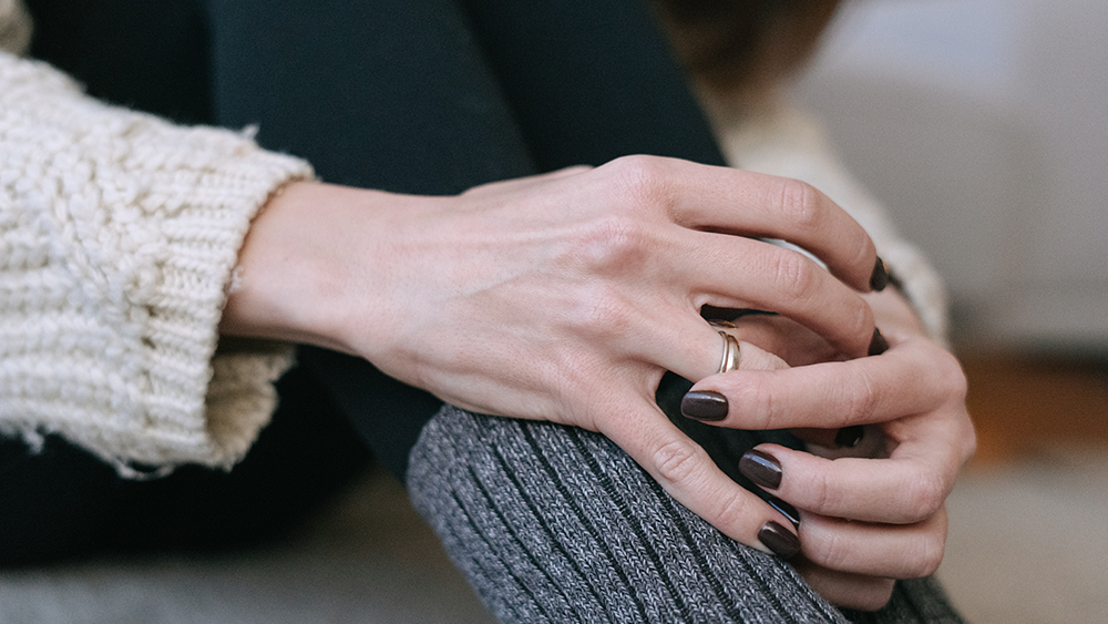 Deciding About Divorce, image of a woman removing her wedding ring